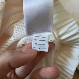 Tommy Jeans jachetă geacă bărbați crem alb-unt