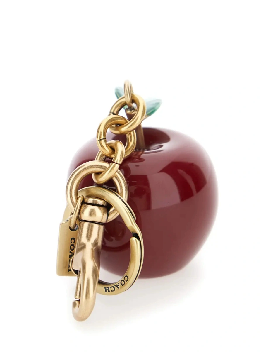 Brelocuri gold and red Keychain with apple shape and embossed logo in metal for women - Img 2