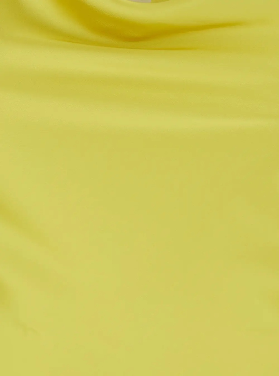 Rochii MARIA GOWN is a long dress characterized by a yellow tech fabric and woman - Img 3