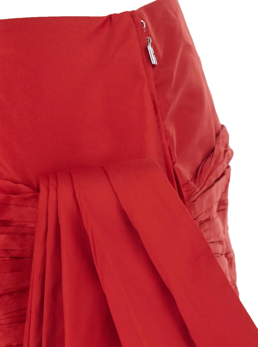 Fusta MINI BOW SKIRT is a skirt characterized by a mini design and a polyester fabric. It is red and is for women. - Img 3