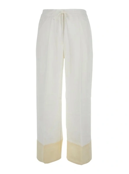 Pantaloni TOTEME albi din matase