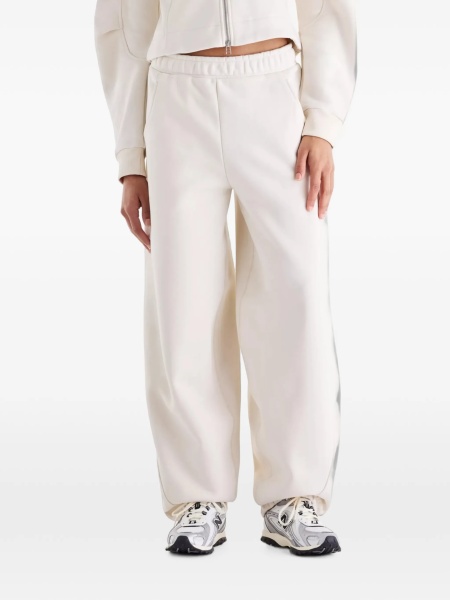Pantaloni de trening New Balance neutri din poliester reciclat si bumbac