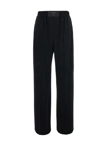 Pantaloni Black Pants with Elastic Waist. They feature a relaxed silhouette and side pockets. In Tech Fabric. Black. Women.