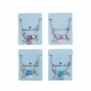 Bratara dama ROXE argintie cu charmuri marine si pandantive elegante, model chic