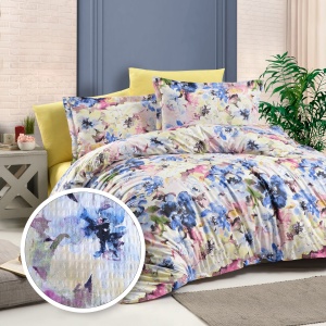 Lenjerie de pat creponată, 100% bumbac – imprimeu floral acuarelă, textură aerată și rafinament modern
