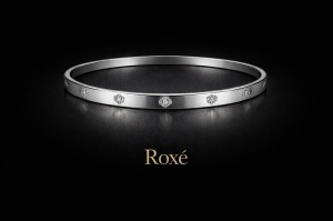Bratara ROXE argintie rigida cu cristale discrete design elegant inchizatoare fixa