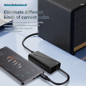 Adaptor Bluetooth M29 – imagine pe birou lângă laptop și boxe portabile