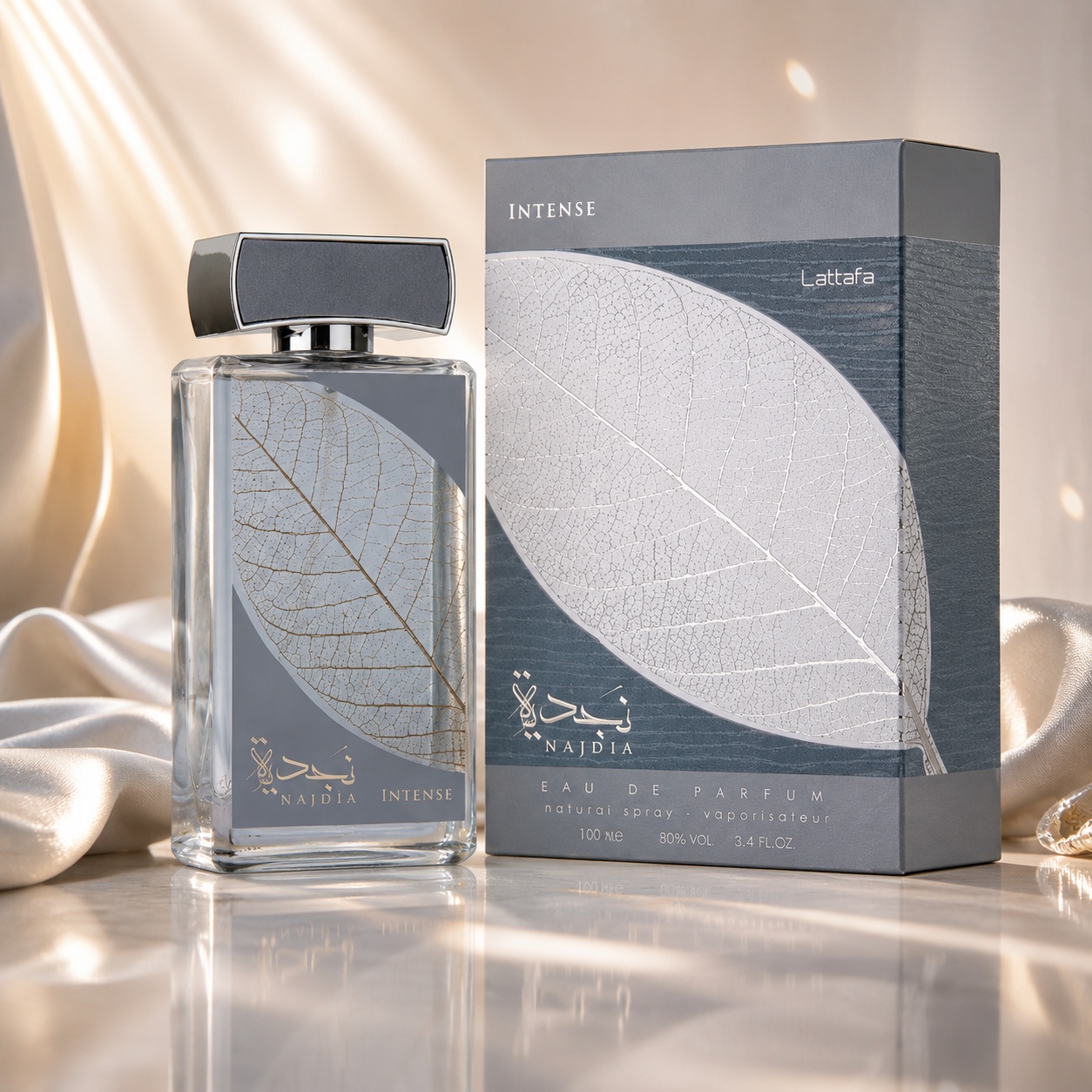 Parfum Arăbesc Najdia Intense Lattafa EDP 100 ml Bărbat cu sticlă gri argintie, frunză decorativă și cutie premium