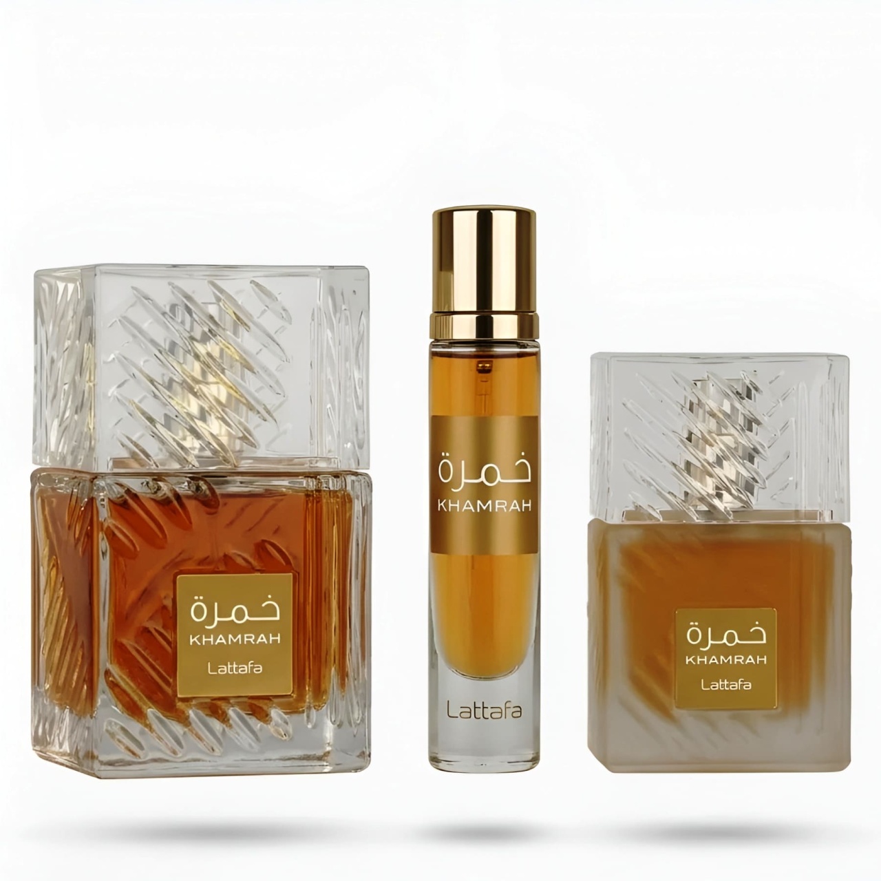 Lattafa Khamrah Giftset prezentare cu parfum, travel spray și hair mist pe fundal alb