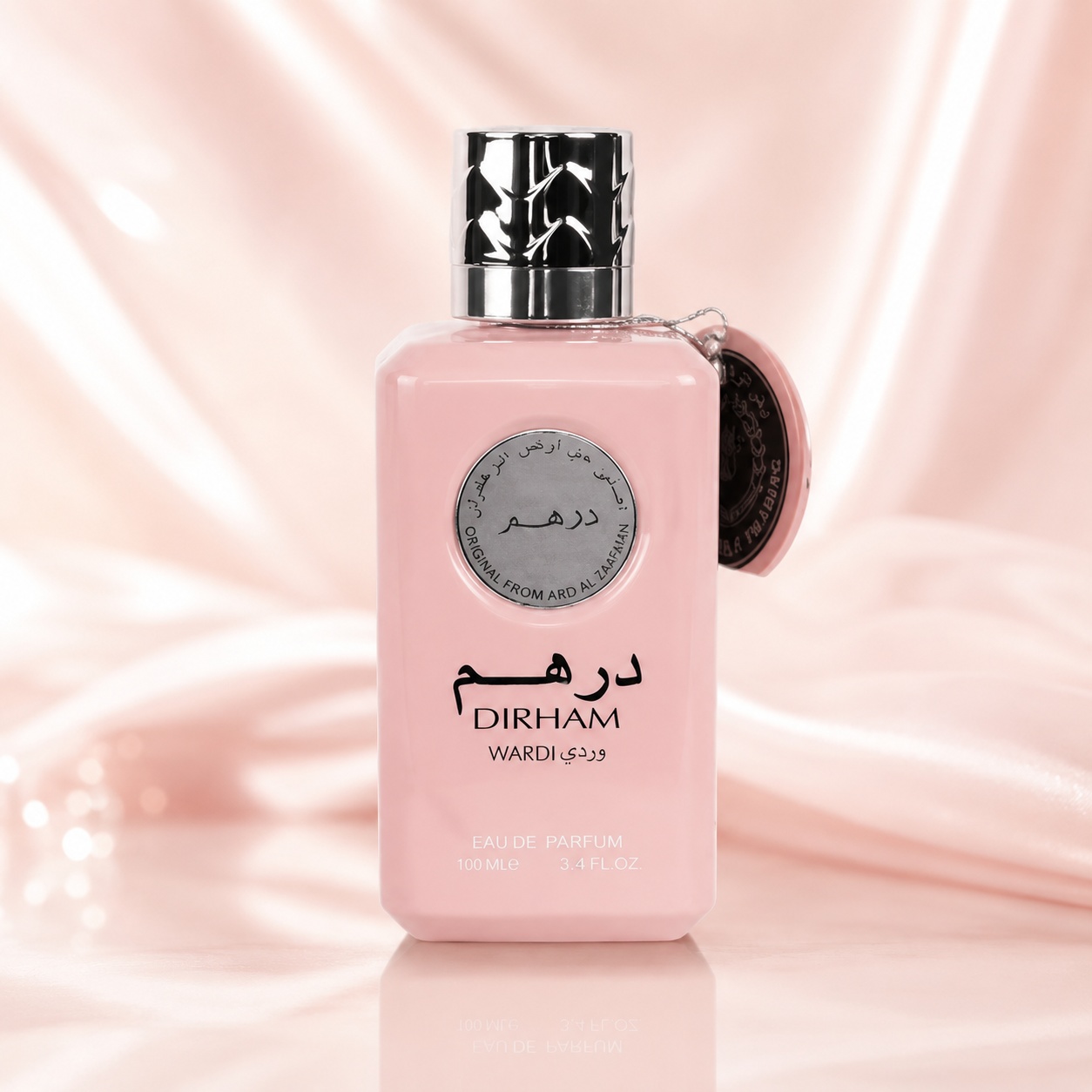 Sticlă parfum Ard Al Zaafaran Dirham Wardi 100 ml pe fundal satinat roz premium