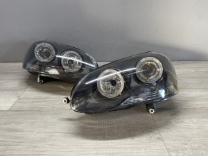 Faruri VW Golf 5 Jetta Angel Eyes look negru cu lupa