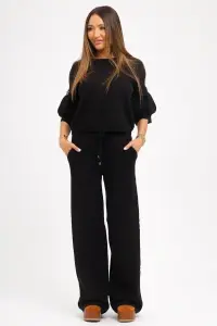 Compleu negru din tricot fin și floricele din pietre pe măneci