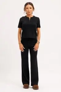 Compleu tricotat negru cu top polo și pantaloni