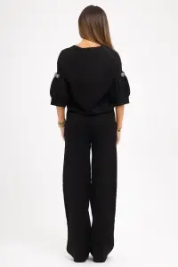 Compleu negru din tricot fin și floricele din pietre pe măneci - Img 3