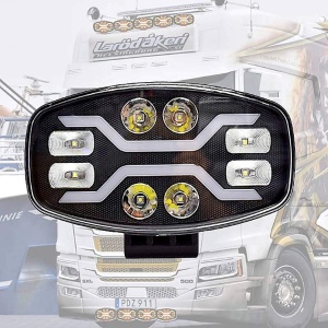 Proiector LED oval cu design modern, prezentat pe fundal de camion pentru utilizare profesională.