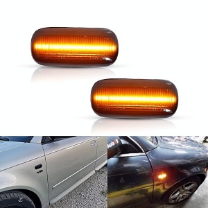 Semnalizare dinamică Audi în funcțiune, cu lumină chihlimbar intensă și exemplu de montaj lateral.