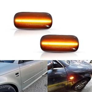 Semnalizare dinamică Audi în funcțiune, cu lumină chihlimbar intensă și exemplu de montaj lateral.